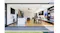 Wide shot of a modern open-plan kitchen, the stainless steel undermount rangehood is installed above the cooktop. Wide shot of a modern open-plan kitchen, the stainless steel undermount rangehood is installed above the cooktop.