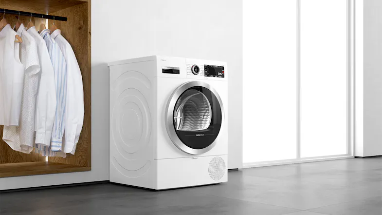 The dryer positioned in a brightly lit modern home The dryer positioned in a brightly lit modern home