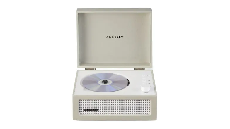Open beige Crosley Voyager Retro portable CD player with FM radio and Bluetooth®, with a disc inside and the control knob visible Open beige Crosley Voyager Retro portable CD player with FM radio and Bluetooth®, with a disc inside and the control knob visible