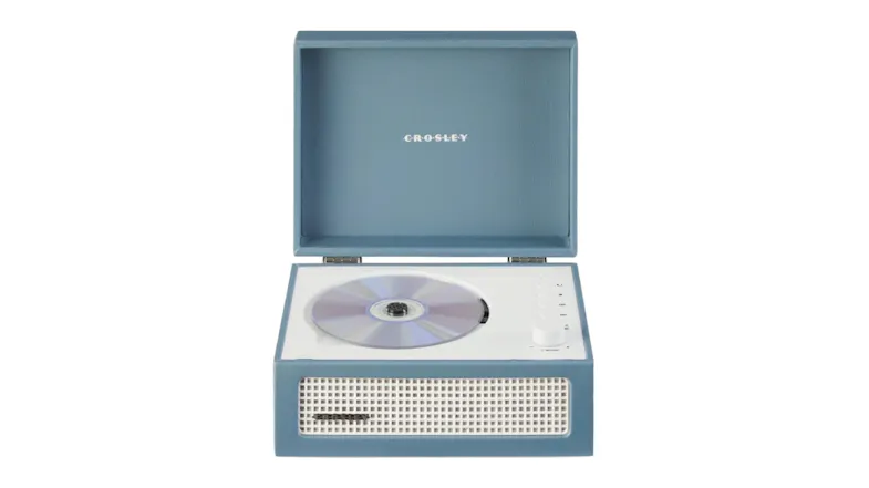 Blue Crosley Voyager retro portable CD player with the lid open, playing a compact disc, with the front speaker grille visible Blue Crosley Voyager retro portable CD player with the lid open, playing a compact disc, with the front speaker grille visible