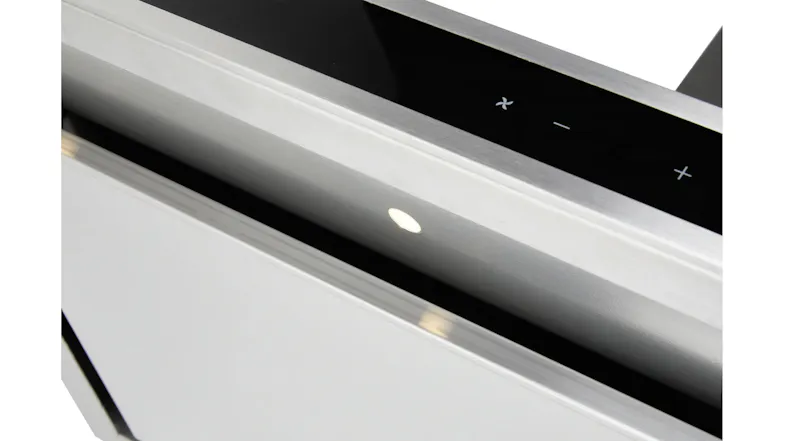 Close-up of rangehood controls showing fan and icons, with built-in lighting glowing underneath Close-up of rangehood controls showing fan and icons, with built-in lighting glowing underneath