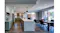 Bright kitchen interior with large island, pendant lighting, and seamless indoor-outdoor living view Bright kitchen interior with large island, pendant lighting, and seamless indoor-outdoor living view