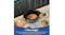 Top view of the oval cooking pot showcasing 8 servings text Top view of the oval cooking pot showcasing 8 servings text