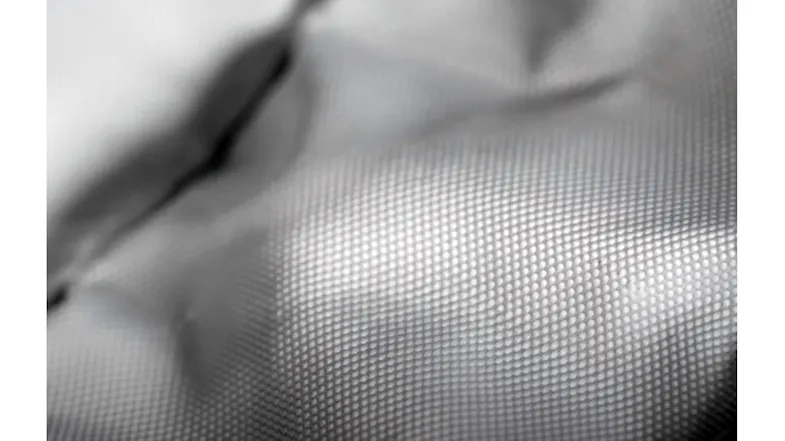 A close-up view of SteelFlex ducting material showing textured reinforced mesh design for durability and strength A close-up view of SteelFlex ducting material showing textured reinforced mesh design for durability and strength