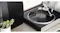 Victrola turntable playing black vinyl beside a Sonos speaker and a small plant on a console in a modern setup Victrola turntable playing black vinyl beside a Sonos speaker and a small plant on a console in a modern setup
