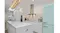 Bright modern kitchen with stainless steel wall-mounted rangehood, white cabinetry, subway tile splashback and pastel fridge Bright modern kitchen with stainless steel wall-mounted rangehood, white cabinetry, subway tile splashback and pastel fridge