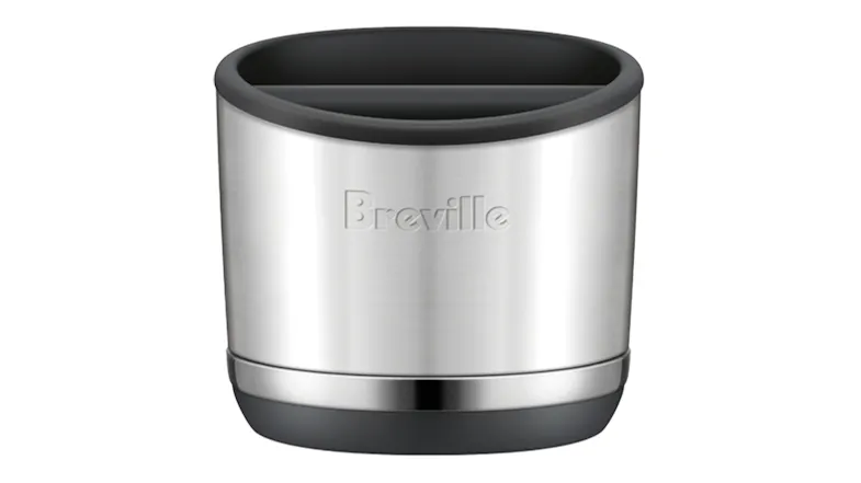 A sleek, stainless steel Breville espresso knock box with a black rubber rim and base bar A sleek, stainless steel Breville espresso knock box with a black rubber rim and base bar