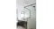 Modern bathroom with a glass shower, black fixtures, vanity sink, mirror, and ceiling ventilation vent Modern bathroom with a glass shower, black fixtures, vanity sink, mirror, and ceiling ventilation vent