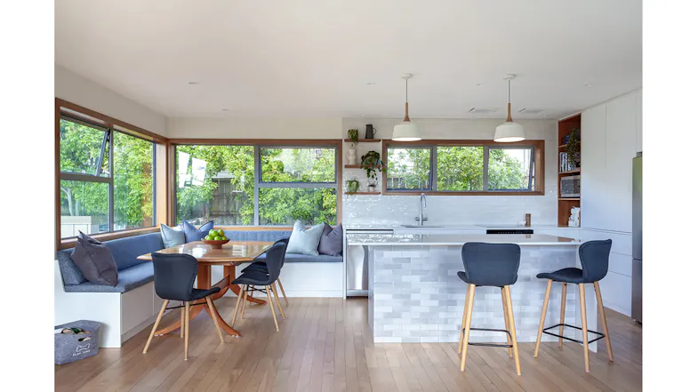 Bright modern kitchen with large windows, dining nook and island bench, featuring ceiling cassette rangehood modules installed Bright modern kitchen with large windows, dining nook and island bench, featuring ceiling cassette rangehood modules installed