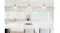 Light-filled kitchen with sleek island, bar stools and modern glass pendant lighting above Light-filled kitchen with sleek island, bar stools and modern glass pendant lighting above