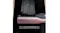 Close-up of the straightener gliding through dark hair, showing smooth plates compressing the strands Close-up of the straightener gliding through dark hair, showing smooth plates compressing the strands