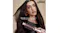 Close-up of a person with long, smooth hair using the peony pink Shark Glossi round brush Close-up of a person with long, smooth hair using the peony pink Shark Glossi round brush