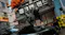 Action gameplay shot of an operative jumping onto a vehicle during a Call of Duty city battle Action gameplay shot of an operative jumping onto a vehicle during a Call of Duty city battle