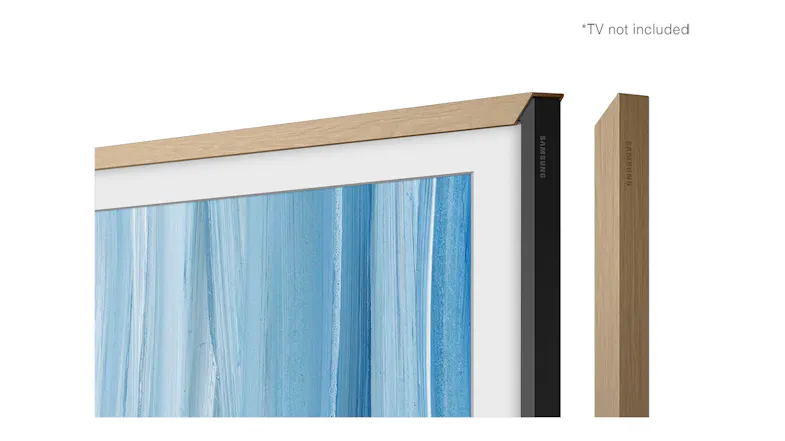 Close-up angled view of the teak bezel attached to a TV, showing the slim wood-textured frame and corner detail Close-up angled view of the teak bezel attached to a TV, showing the slim wood-textured frame and corner detail