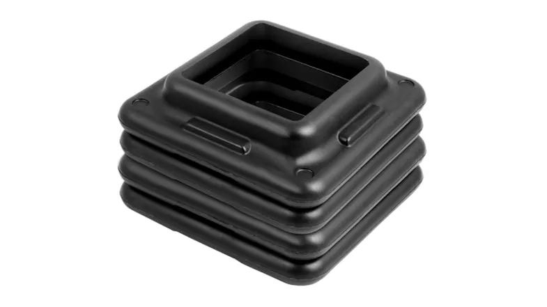 A stack of four square black plastic risers for an Everfit aerobic exercise step platform A stack of four square black plastic risers for an Everfit aerobic exercise step platform
