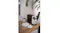 Wooden table setting featuring the coffee machine alongside a water carafe and cups Wooden table setting featuring the coffee machine alongside a water carafe and cups