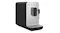 Three-quarter view of the automatic coffee machine showcasing the steam wand Three-quarter view of the automatic coffee machine showcasing the steam wand