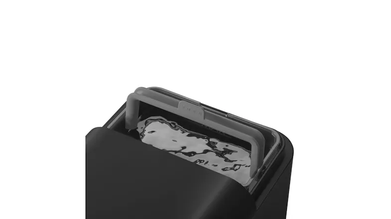 Top view of the coffee machine featuring a removable water tank with a handle Top view of the coffee machine featuring a removable water tank with a handle