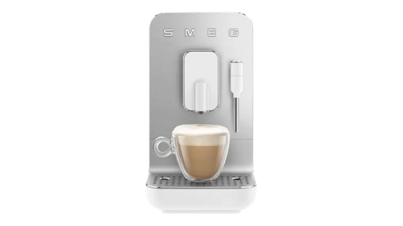 Front view of the Smeg unit featuring a cup filled with a layered coffee drink Front view of the Smeg unit featuring a cup filled with a layered coffee drink