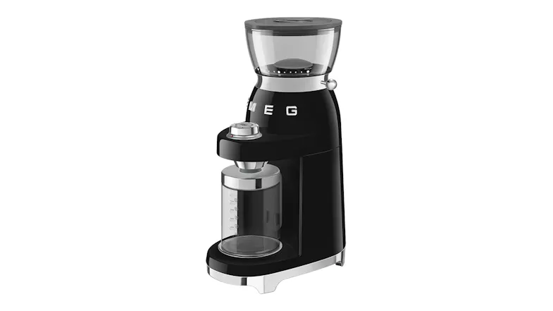 Three-quarter front view of the grinder with an empty container attached Three-quarter front view of the grinder with an empty container attached