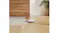 Side profile of the vacuum, highlighting its slim edge on a rug Side profile of the vacuum, highlighting its slim edge on a rug