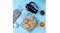 A blue kitchen counter showing freshly baked cookies next to a hand mixer A blue kitchen counter showing freshly baked cookies next to a hand mixer
