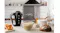 Modern kitchen scene showing a hand mixer standing beside bread dough Modern kitchen scene showing a hand mixer standing beside bread dough