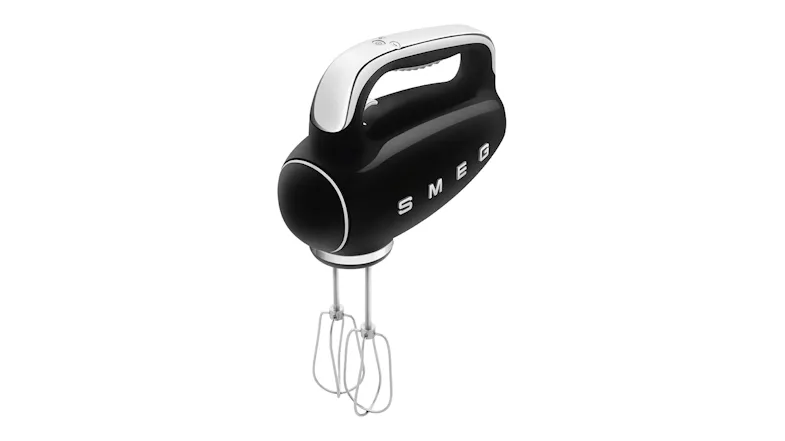 Perspective view of an electric hand mixer showcasing wire beaters Perspective view of an electric hand mixer showcasing wire beaters