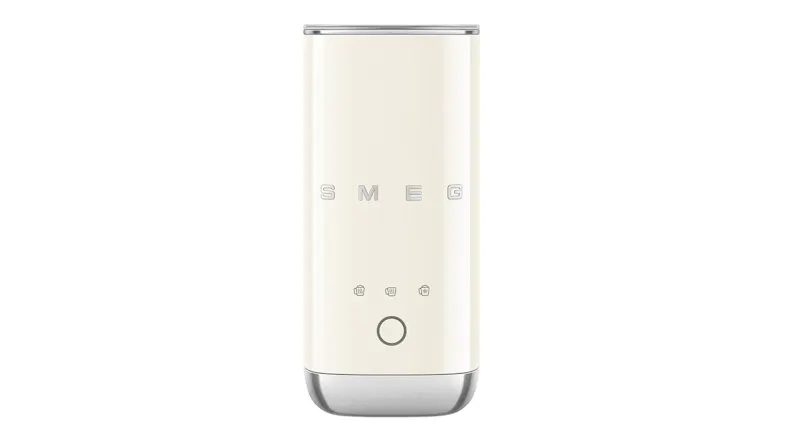 Front view of a glossy cream Smeg mini milk frother with a slim cylindrical body and chrome base Front view of a glossy cream Smeg mini milk frother with a slim cylindrical body and chrome base