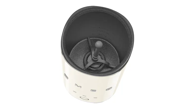 Top-down interior view with lid removed, revealing the stainless steel chamber and small whisk attachment Top-down interior view with lid removed, revealing the stainless steel chamber and small whisk attachment