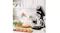 Lifestyle scene of the glossy black Smeg stand mixer on a kitchen counter with the dough hook attached Lifestyle scene of the glossy black Smeg stand mixer on a kitchen counter with the dough hook attached