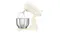 Side angle of the Smeg cream stand mixer with tilt head raised and wire whisk attached above a stainless steel bowl Side angle of the Smeg cream stand mixer with tilt head raised and wire whisk attached above a stainless steel bowl