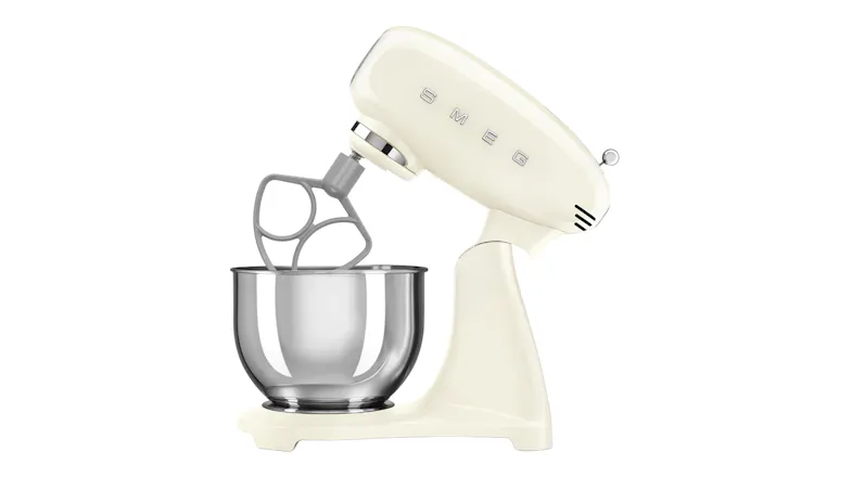 Side angle of the Smeg mixer with tilt head raised, fitted with a flex-edge or alternative beater attachment Side angle of the Smeg mixer with tilt head raised, fitted with a flex-edge or alternative beater attachment