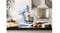 Smeg stand mixer with tilt head raised and wire whisk attachment over a stainless steel bowl on a countertop Smeg stand mixer with tilt head raised and wire whisk attachment over a stainless steel bowl on a countertop
