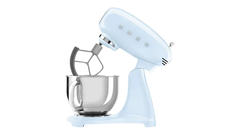 Side view of the glossy pastel blue Smeg stand mixer with tilt head raised and flat beater attachment Side view of the glossy pastel blue Smeg stand mixer with tilt head raised and flat beater attachment