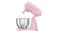 Side angle of the Smeg stand mixer with tilt head raised and wire whisk attached above a stainless steel bowl Side angle of the Smeg stand mixer with tilt head raised and wire whisk attached above a stainless steel bowl