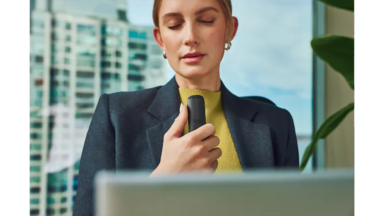 Front view of a person holding a remote control upright Front view of a person holding a remote control upright