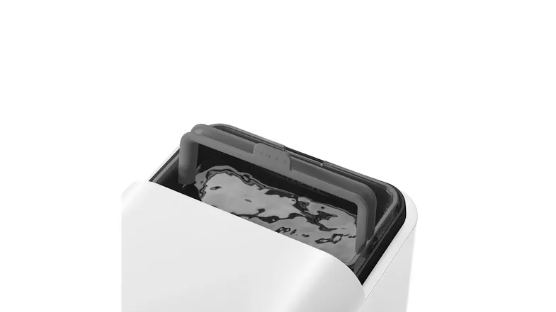 Top view of the coffee machine featuring a removable water tank with a handle Top view of the coffee machine featuring a removable water tank with a handle