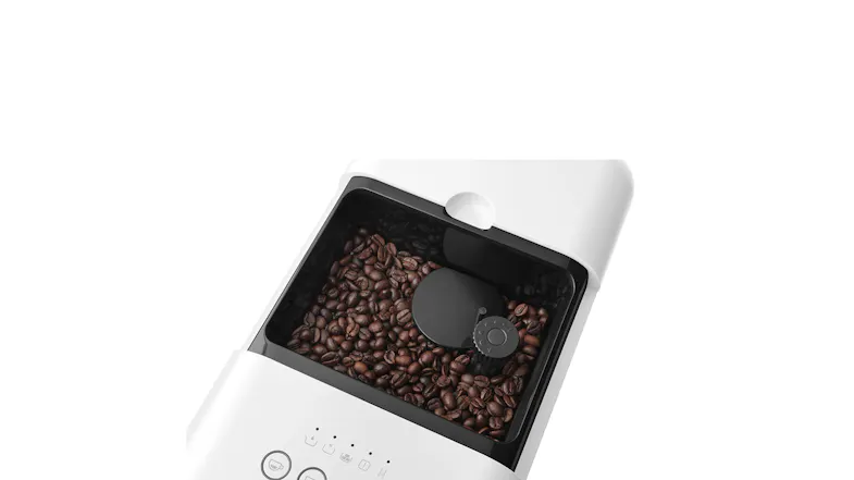 Top-down view of the Smeg unit showcasing a hopper filled with coffee beans Top-down view of the Smeg unit showcasing a hopper filled with coffee beans