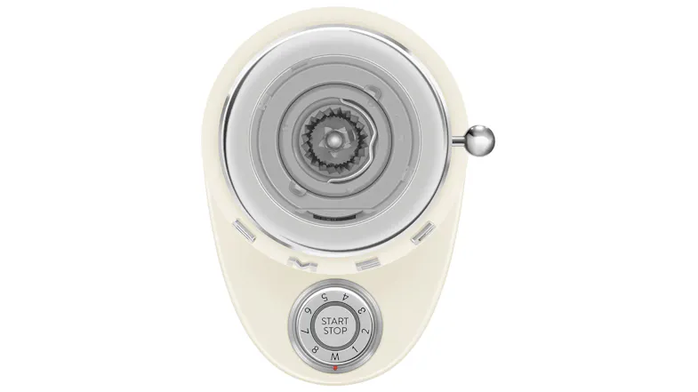 Top-down view of Smeg coffee grinder showing burr mechanism and circular start-stop dial with numbered settings Top-down view of Smeg coffee grinder showing burr mechanism and circular start-stop dial with numbered settings