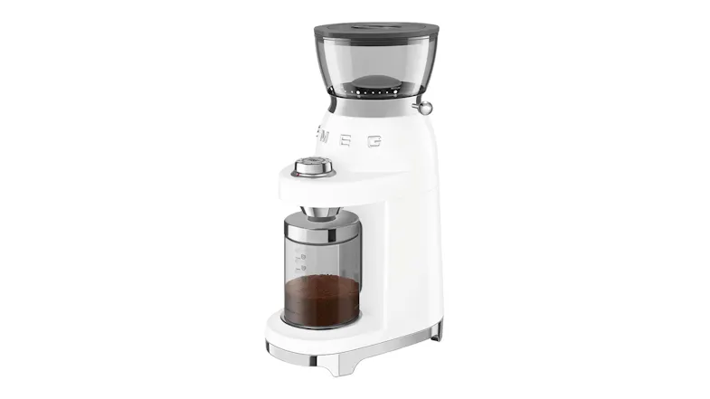 A coffee grinder with ground coffee inside a clear container, highlighting modern design and precision grinding A coffee grinder with ground coffee inside a clear container, highlighting modern design and precision grinding