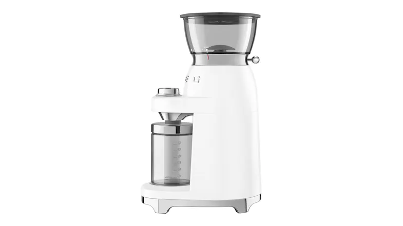Side profile of white Smeg coffee grinder with transparent hopper and container, emphasising compact, elegant build Side profile of white Smeg coffee grinder with transparent hopper and container, emphasising compact, elegant build