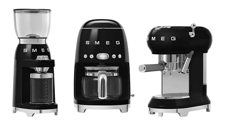 Three Smeg coffee appliances, including a grinder, brewer, and espresso maker Three Smeg coffee appliances, including a grinder, brewer, and espresso maker