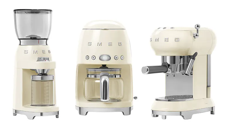 Three Smeg coffee appliances, including a grinder, brewer, and espresso maker Three Smeg coffee appliances, including a grinder, brewer, and espresso maker