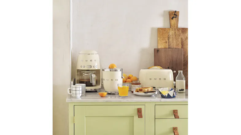 A cosy kitchen counter highlighting a collection of Smeg appliances A cosy kitchen counter highlighting a collection of Smeg appliances