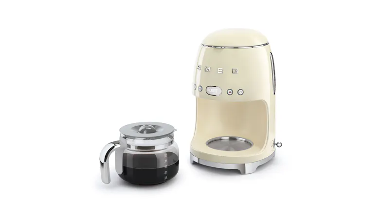 Front view of the Smeg drip coffee machine with the carafe alongside Front view of the Smeg drip coffee machine with the carafe alongside