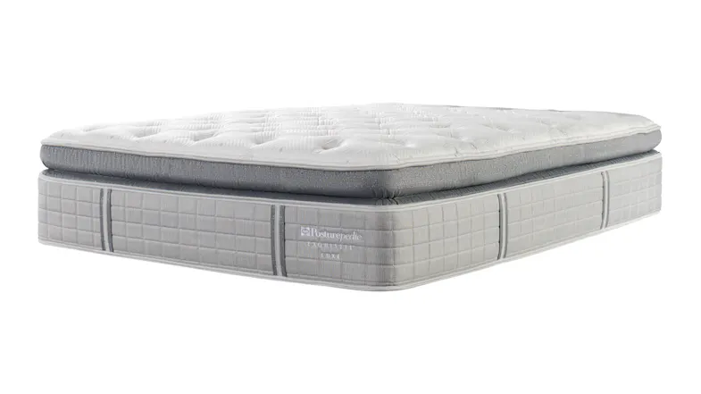 A studio shot showing the side profile and plush pillow-top design of a Exquisite Boutique Soft Bed A studio shot showing the side profile and plush pillow-top design of a Exquisite Boutique Soft Bed