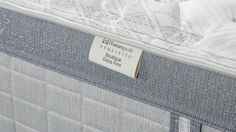 A close up view of the product's 'Boutique Extra Firm' tag A close up view of the product's 'Boutique Extra Firm' tag
