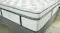 Close-up of the Sleep Smart soft mattress, showcasing its white quilted top and grey side panel design Close-up of the Sleep Smart soft mattress, showcasing its white quilted top and grey side panel design