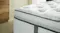 Side profile of the Graphite Medium mattress focusing on the thick comfort layer and piping Side profile of the Graphite Medium mattress focusing on the thick comfort layer and piping